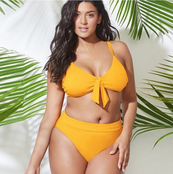 Lady wearing a plus size yellow bikini